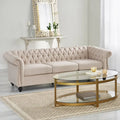 Beige tufted three-seater sofa, adorned with rivets