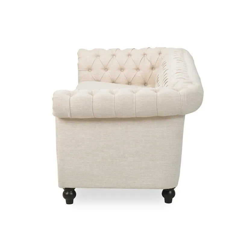 Beige tufted three-seater sofa, adorned with rivets